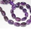 Natural Purple Amethyst Smooth Polished Oval Tumble Beads Strand Length is 14 Inches & Sizes from 12mm to 15mm approx. Pronounced AM-eth-ist, this lovely stone comes in two color variations of Purple and Pink. This gemstones belongs to quartz family. All strands are hand picked. 